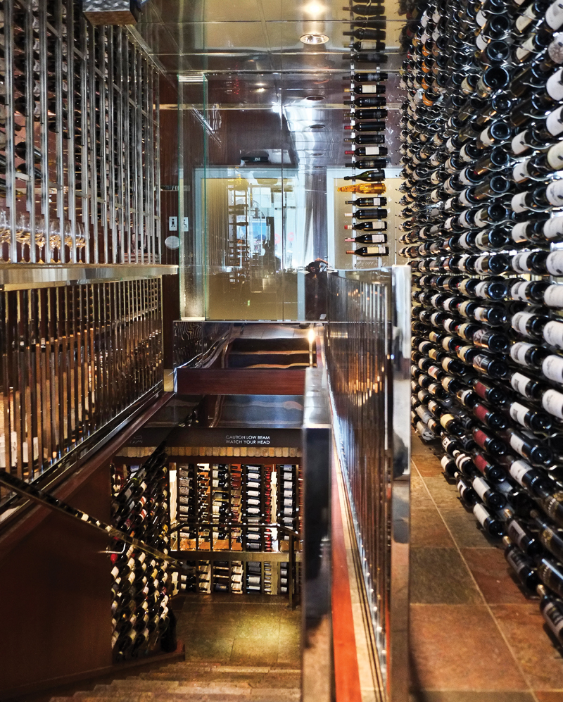 Luma’s signature glass wine cellar leads to a private dining room downstairs.