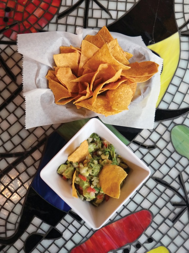 The guacamole (above) starts with two unpeeled avocados in a wooden bowl, and is made at your table by a server.