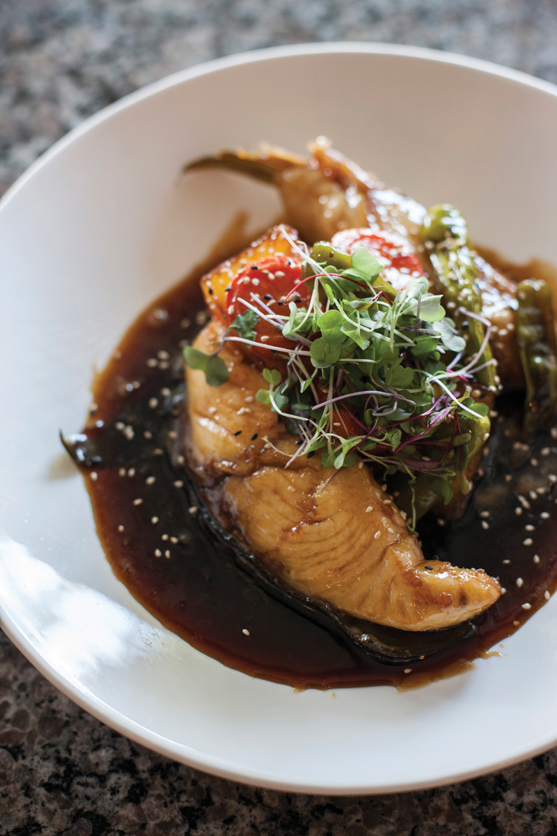 Soy-glazed yellowtail is simmered with Asian vegetables, creating a dish as colorful as it is tasty. 